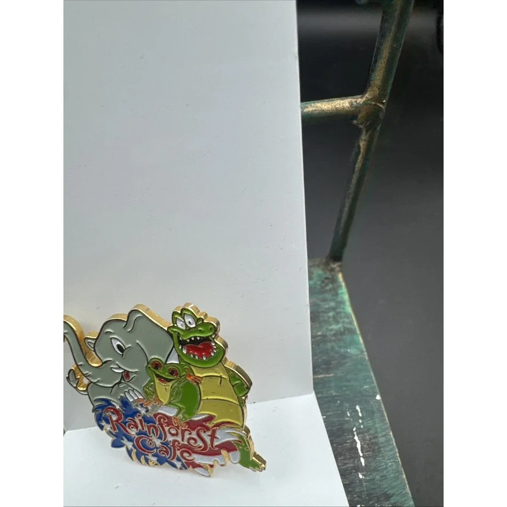 Rainforest Cafe Pin Featuring Nike, Cha Cha, Tuki American Flag